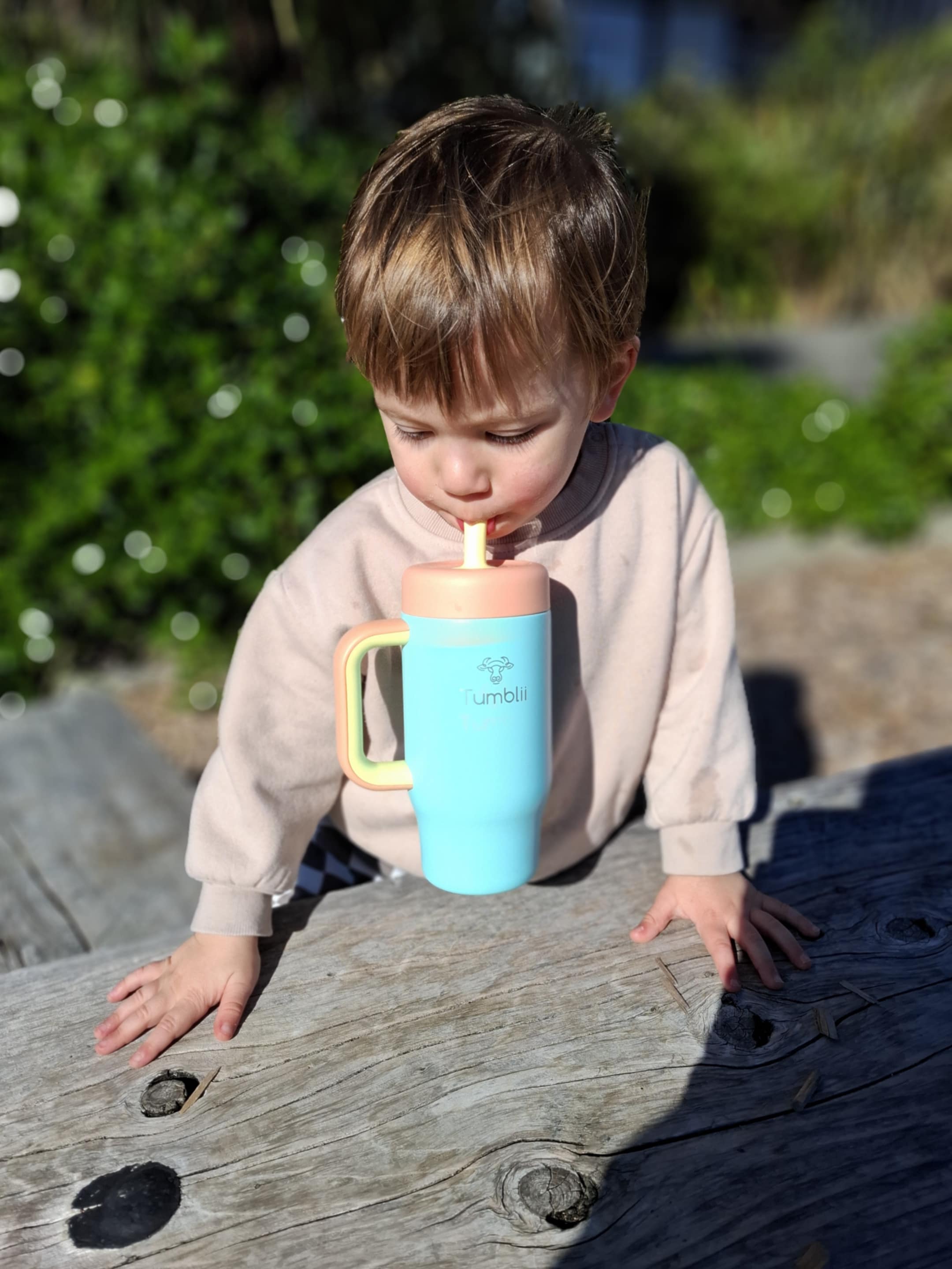 toddler drinking from tumblii stainless steel tumbler straw cup